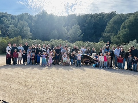 Large family and friends group photo at a Paradise Stables event