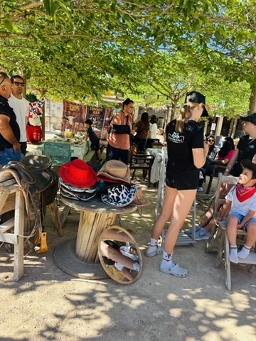 Hat and helmet styling station at a themed party at Paradise Stables