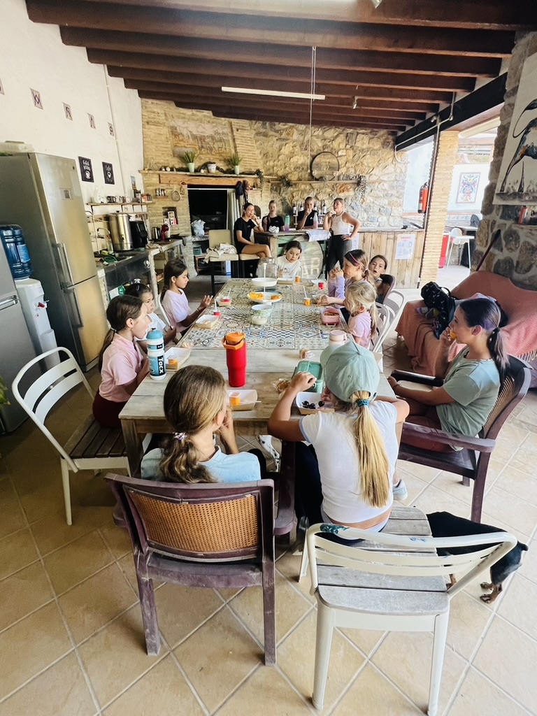 Riders sharing lunch together in the Paradise Stables clubhouse between lessons