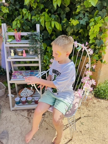 Young boy doing arts and crafts at a themed party at Paradise Stables
